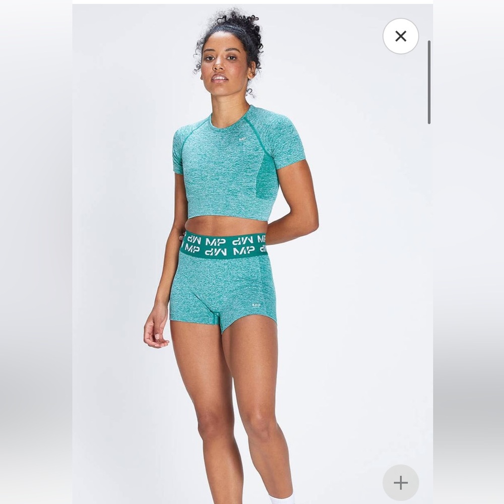 My Protein MP crop top, sports bra, and shorts evergreen